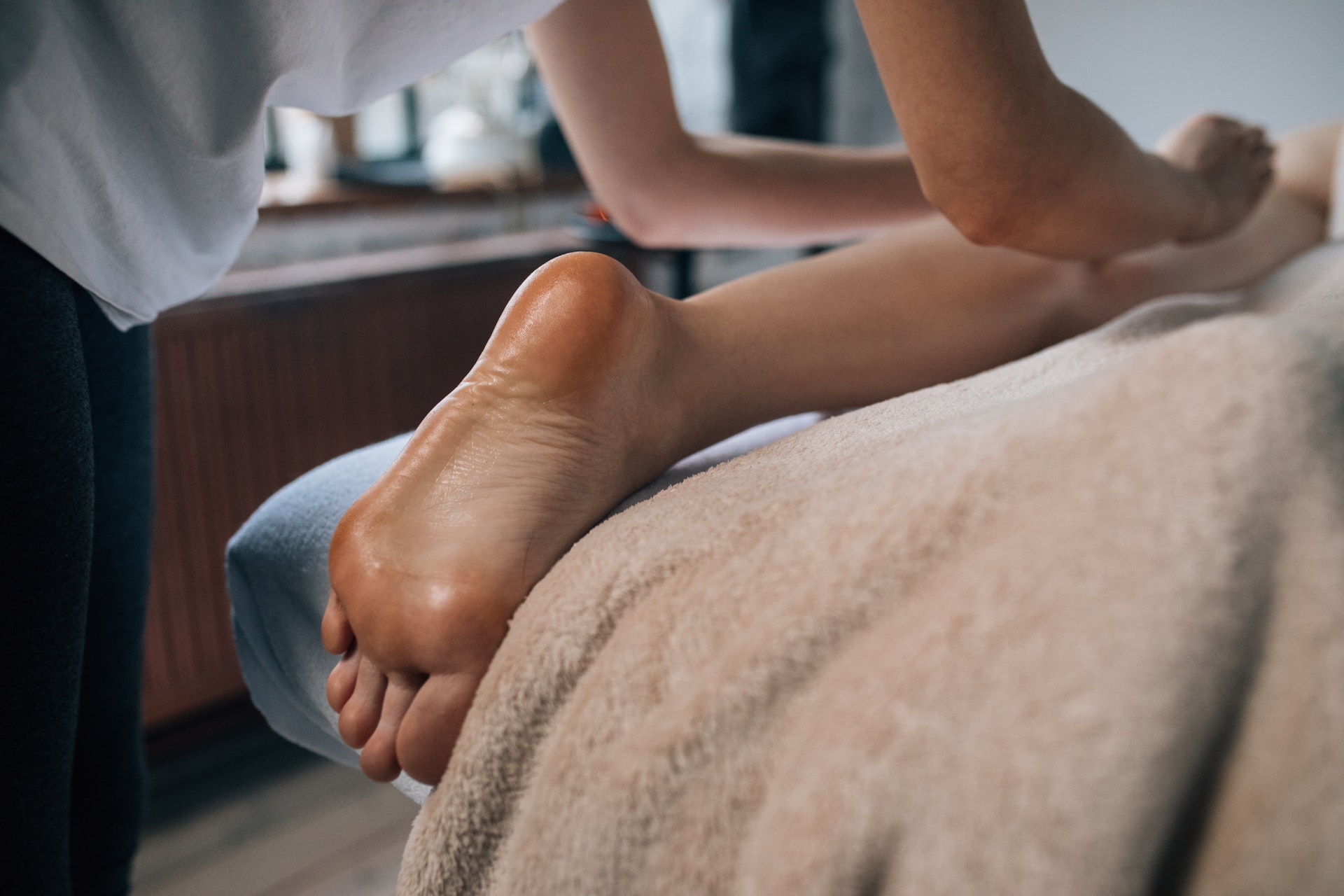 a medical person checking for varicose veins on feet Vascular health